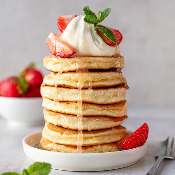 Puffed Pancakes with Strawberries, Cinnamon Syrup and Lemon Cream